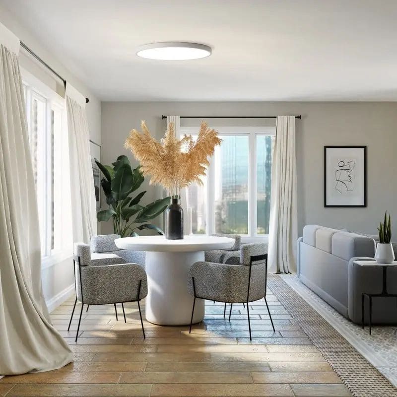 Plafonnier blanc dans un salon moderne blanc et bois pour illustrer le meilleur type d'éclairage