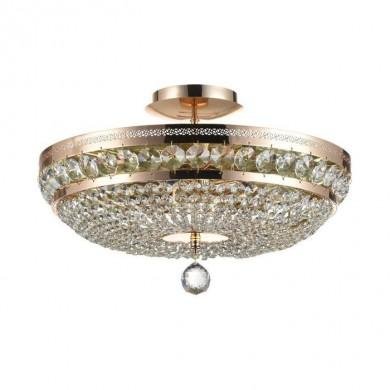 Différence suspension et plafonnier présentée avec ce lustre lumineux et décoratif suspendu au plafond.