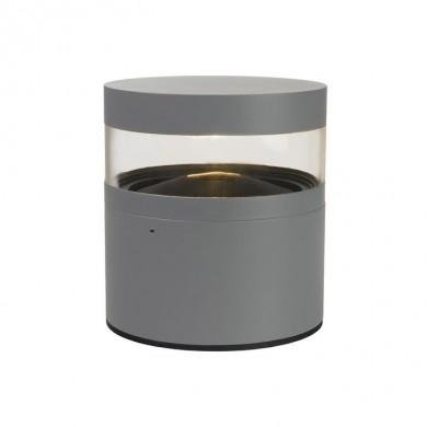 Lampe d’extérieur moderne avec base gris clair et enceinte transparente montrant un réflecteur intérieur, silhouette cylindrique.