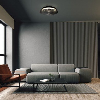 Ventilateur sans pales bruit près du plafond dans un salon contemporain, cadre sombre et canapé gris, ambiance silencieuse pour dormir.